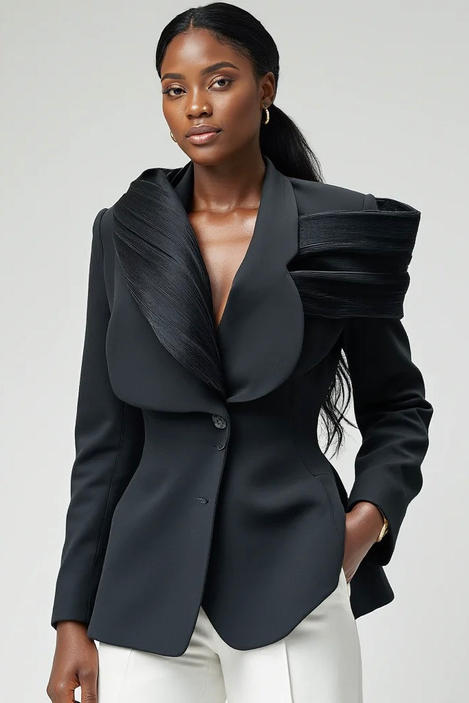 ELOLI Mbene Suit in a bold red colourway with dramatic pleated shoulders