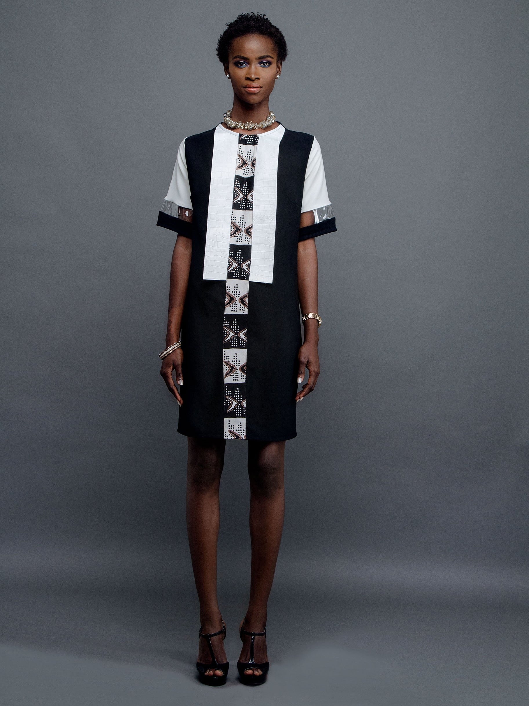 Classic Black shift dress with African print leather and plexi detail